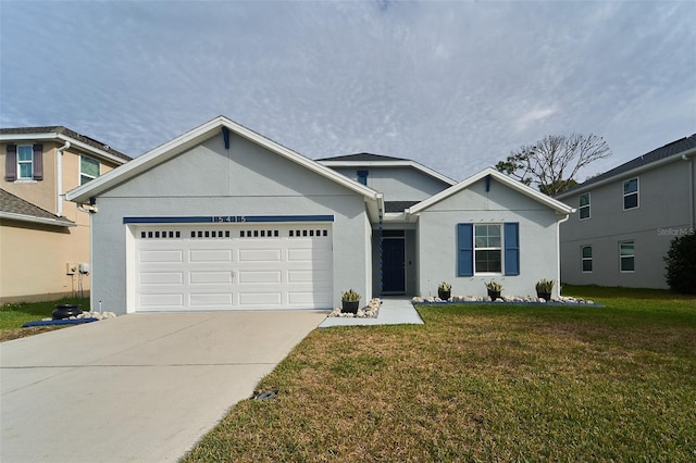 view of front of house featuring a front lawn and a garage