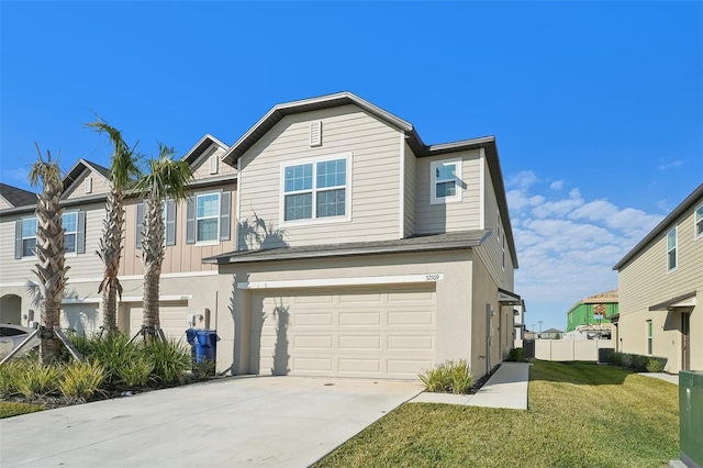 view of front of property with a front lawn and a garage