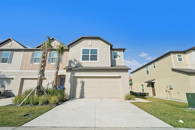 view of front of home featuring a front lawn and a garage