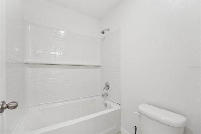 bathroom featuring toilet and bathtub / shower combination