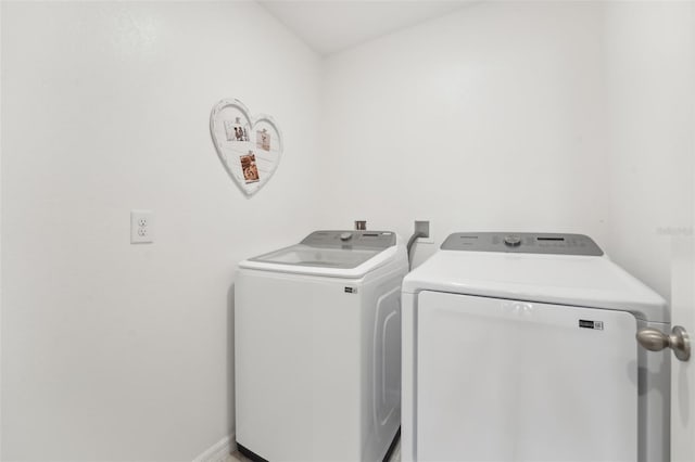 laundry room with washing machine and clothes dryer