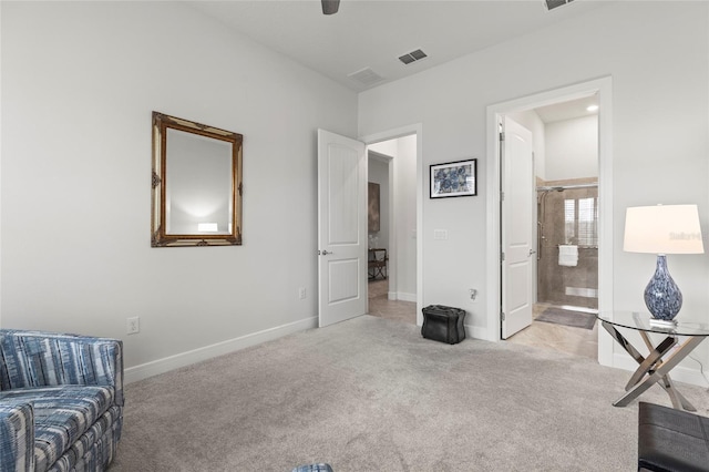 sitting room with light carpet, baseboards, and visible vents