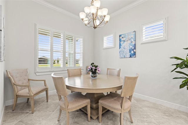 dining space with ornamental molding, a chandelier, and baseboards