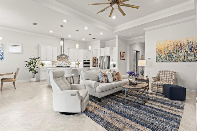 living area with ornamental molding, recessed lighting, visible vents, and baseboards