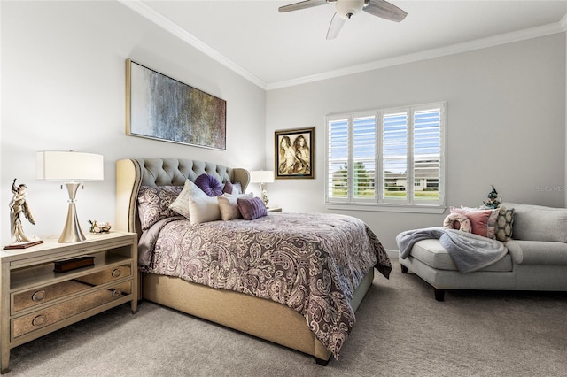 carpeted bedroom featuring ceiling fan and crown molding