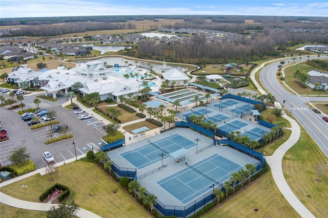 drone / aerial view featuring a water view and a residential view