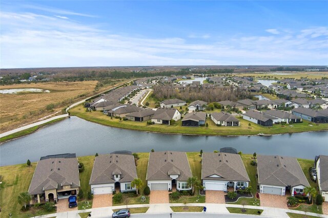 aerial view featuring a water view and a residential view