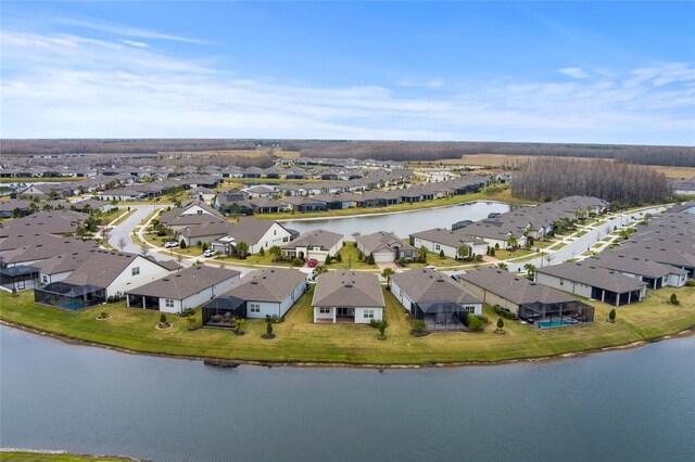 bird's eye view with a residential view and a water view