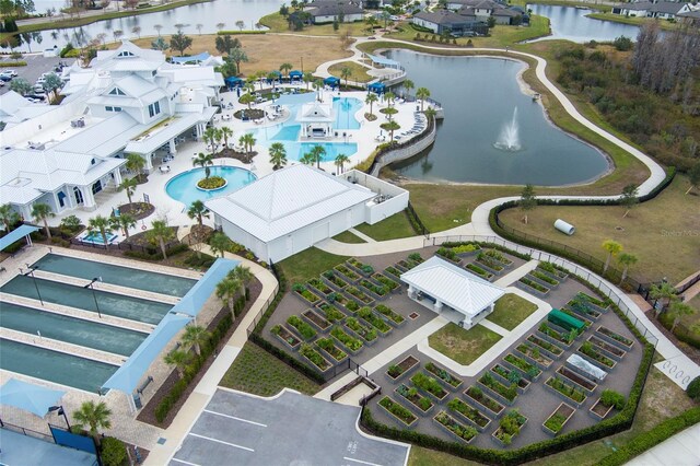 birds eye view of property featuring a water view and a residential view