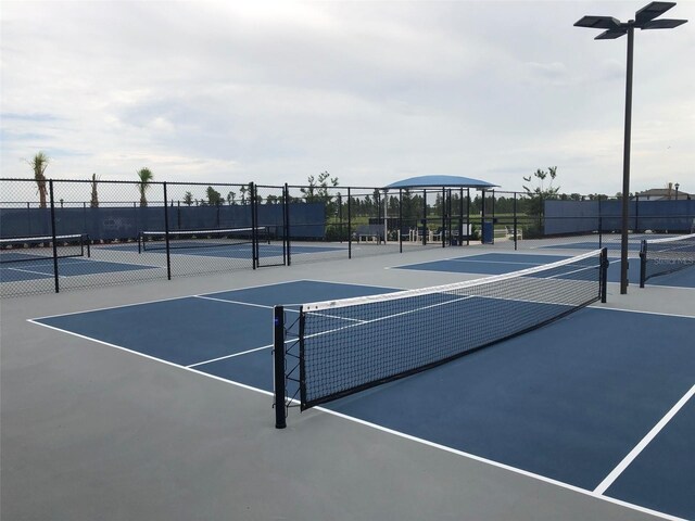 view of sport court with fence