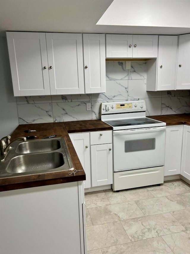 kitchen with sink, white cabinetry, electric stove, and decorative backsplash