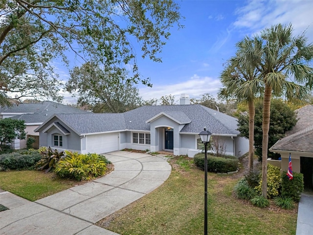 ranch-style house with a front yard and a garage