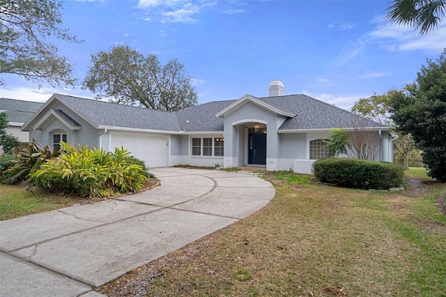 ranch-style home with a front yard and a garage