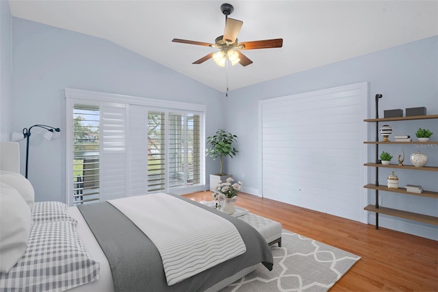 bedroom featuring vaulted ceiling, ceiling fan, and light hardwood / wood-style floors