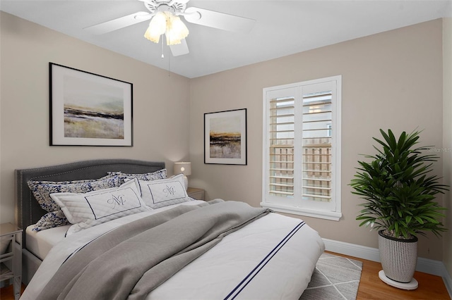 bedroom featuring ceiling fan and hardwood / wood-style floors