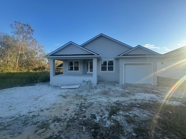 single story home with a garage