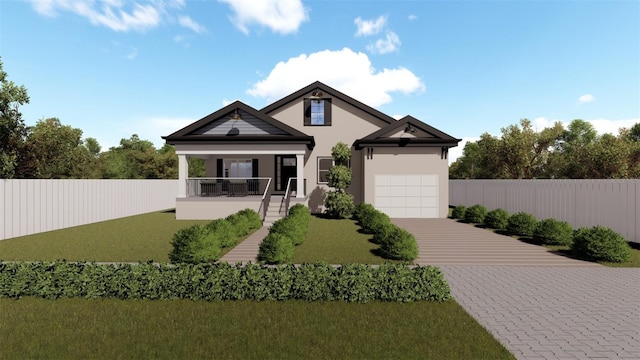 view of front of property featuring a front yard, a garage, and covered porch