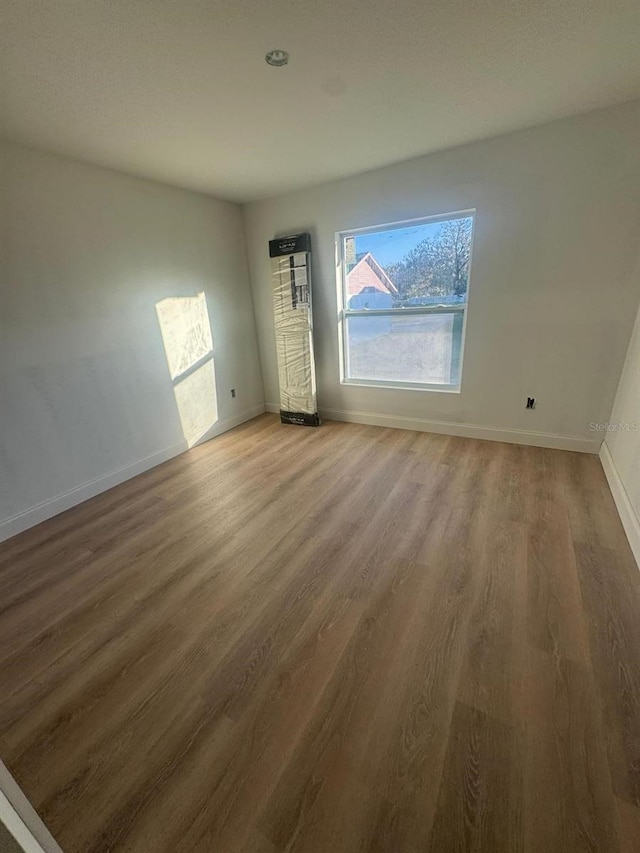 spare room featuring hardwood / wood-style flooring