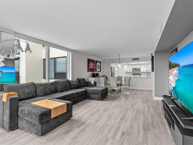 living room with light hardwood / wood-style floors