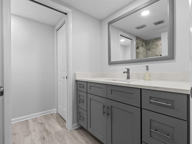 bathroom featuring vanity and wood-type flooring