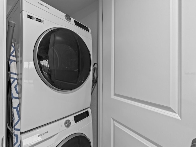 washroom with stacked washer and dryer