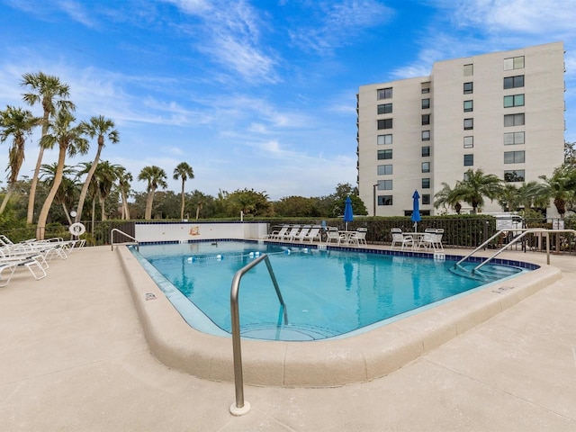 view of swimming pool featuring a patio area