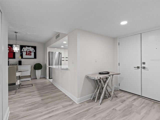 dining space featuring light hardwood / wood-style floors