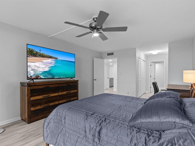 bedroom featuring ceiling fan and light hardwood / wood-style floors