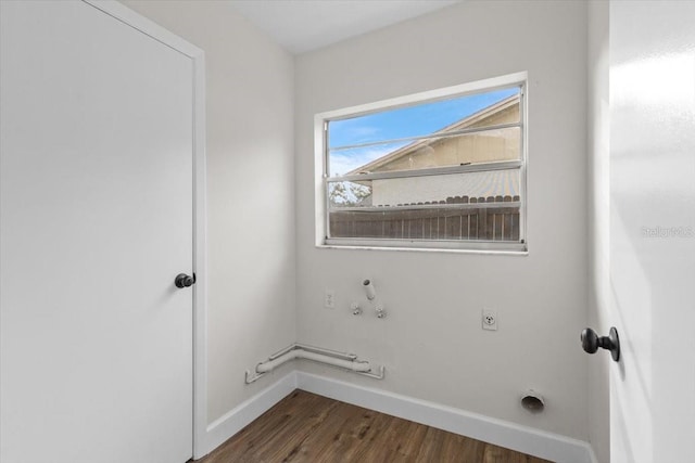 laundry area with gas dryer hookup, dark wood-type flooring, and hookup for an electric dryer