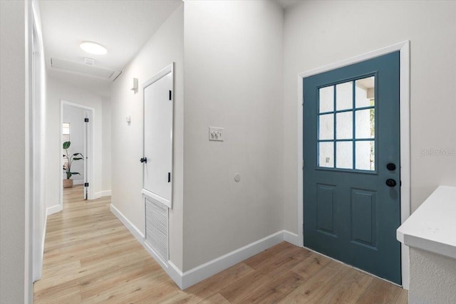 entryway with light hardwood / wood-style flooring