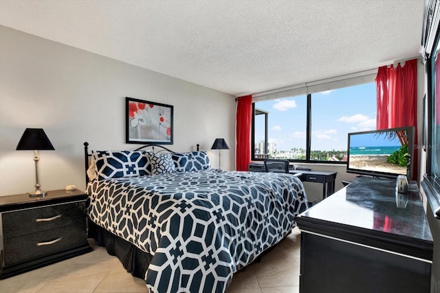 tiled bedroom with a textured ceiling