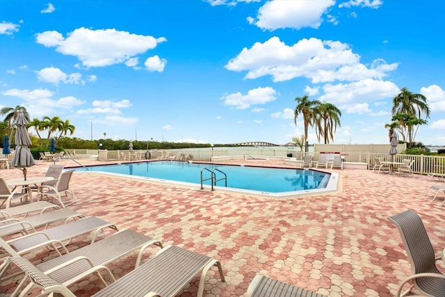 view of swimming pool with a patio