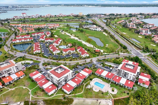 birds eye view of property with a water view