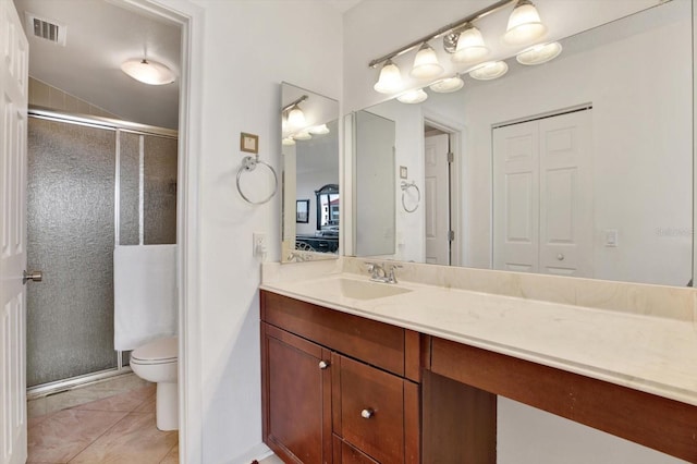 bathroom featuring toilet, tile patterned floors, vanity, a shower with shower door, and lofted ceiling