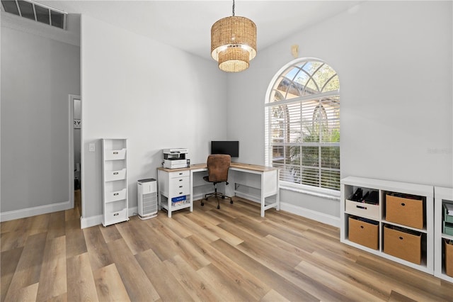 home office featuring light hardwood / wood-style floors