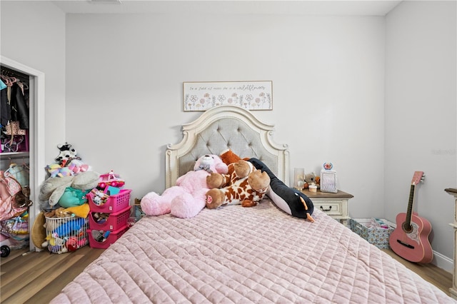 bedroom featuring dark hardwood / wood-style floors