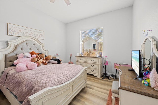 bedroom with ceiling fan and light hardwood / wood-style flooring