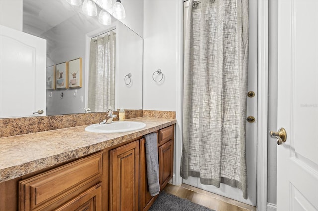 bathroom featuring vanity and wood-type flooring