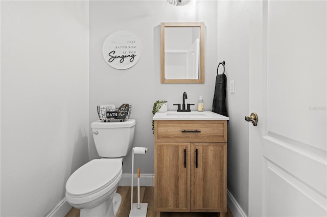 bathroom with toilet and vanity