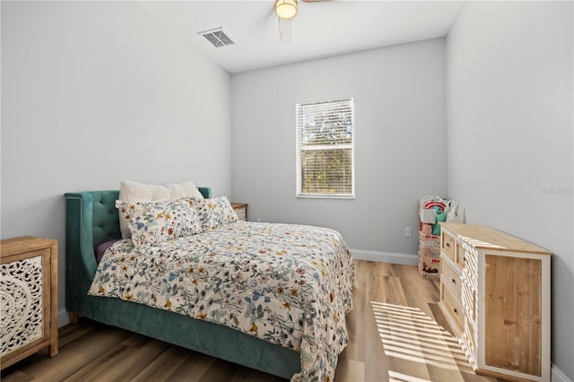 bedroom featuring ceiling fan and wood-type flooring