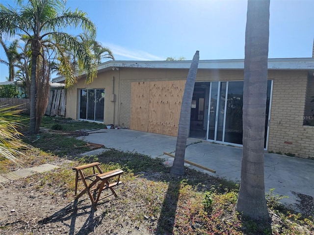 back of property with a patio