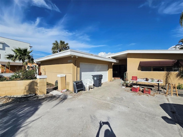 view of side of property with a garage