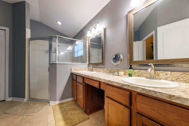 bathroom featuring lofted ceiling, tile patterned flooring, an enclosed shower, and vanity