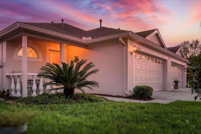 property exterior at dusk with a garage