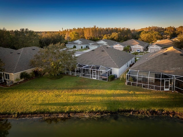 drone / aerial view featuring a water view