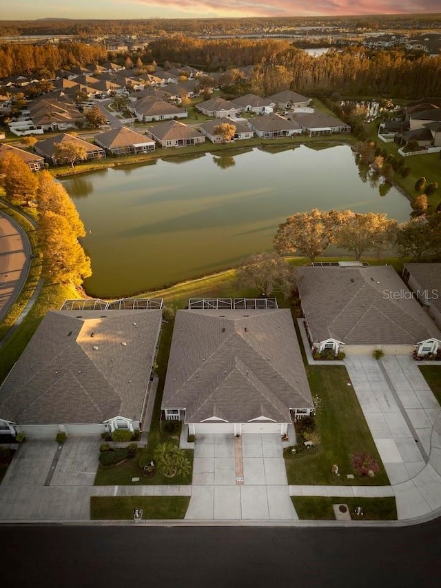 aerial view at dusk with a water view