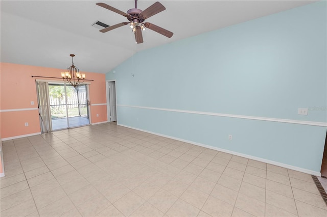 empty room featuring vaulted ceiling, light tile patterned floors, and ceiling fan with notable chandelier