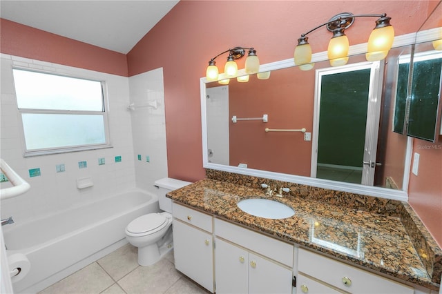 full bathroom with toilet, vanity, tile patterned flooring, lofted ceiling, and tiled shower / bath combo