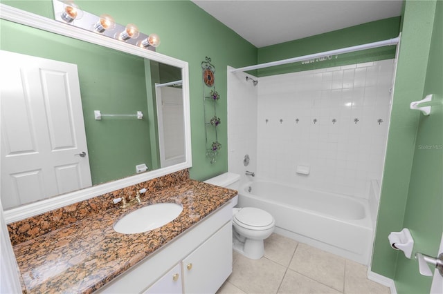 full bathroom featuring toilet, tile patterned floors, vanity, and  shower combination