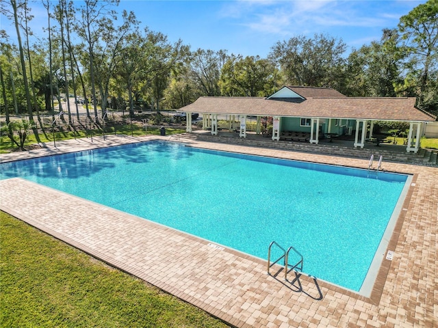 view of swimming pool with a patio area